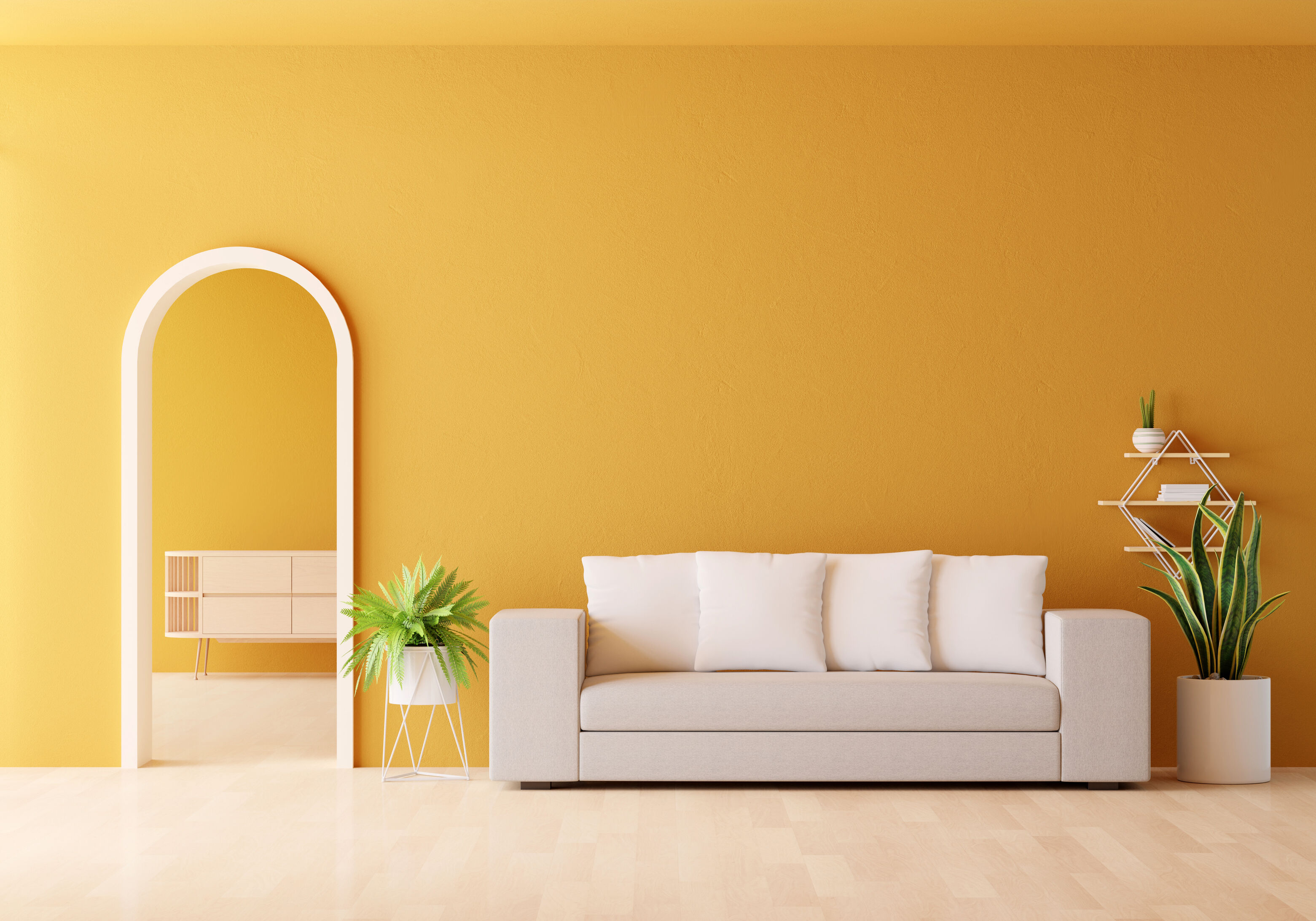 Warm yellow wall colour transforming the look and feel of a modern living room with an arched doorway.